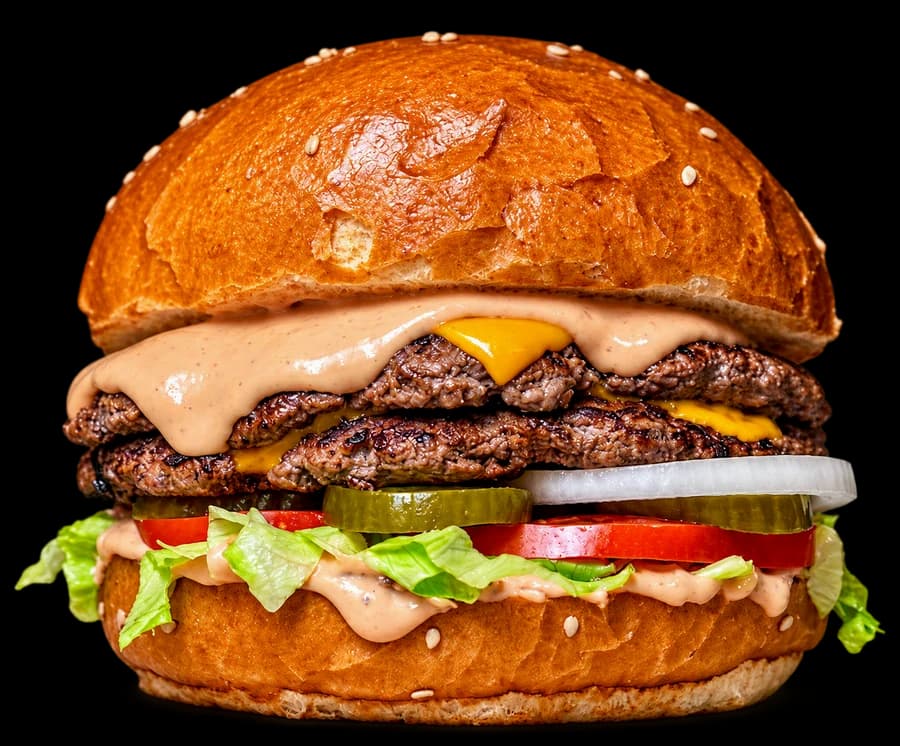 Fresh double smash burger with cheese, tomato and lettuce in a brioche bun